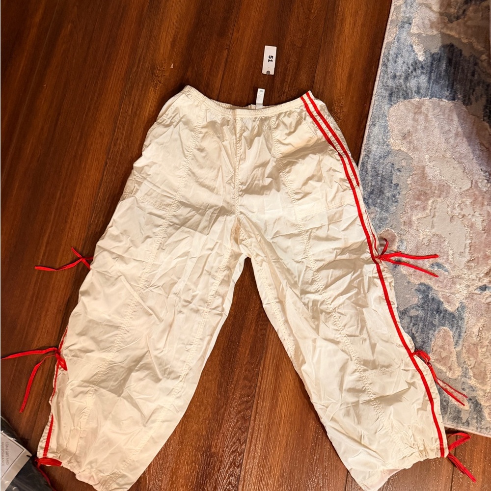 Anthropologie Cream Track Pants with Red bows
